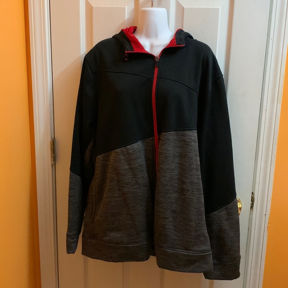 Athletic jacket black and gray and red with a hood.